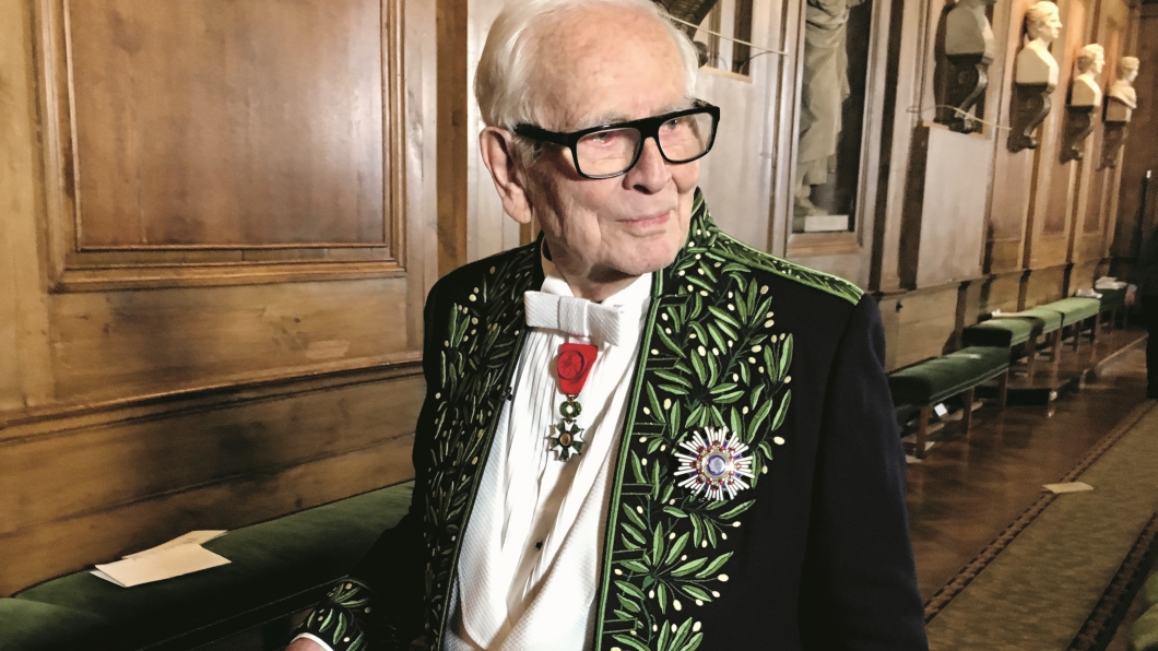 Pierre Cardin mens fashion. Pierre Cardin pictured seated